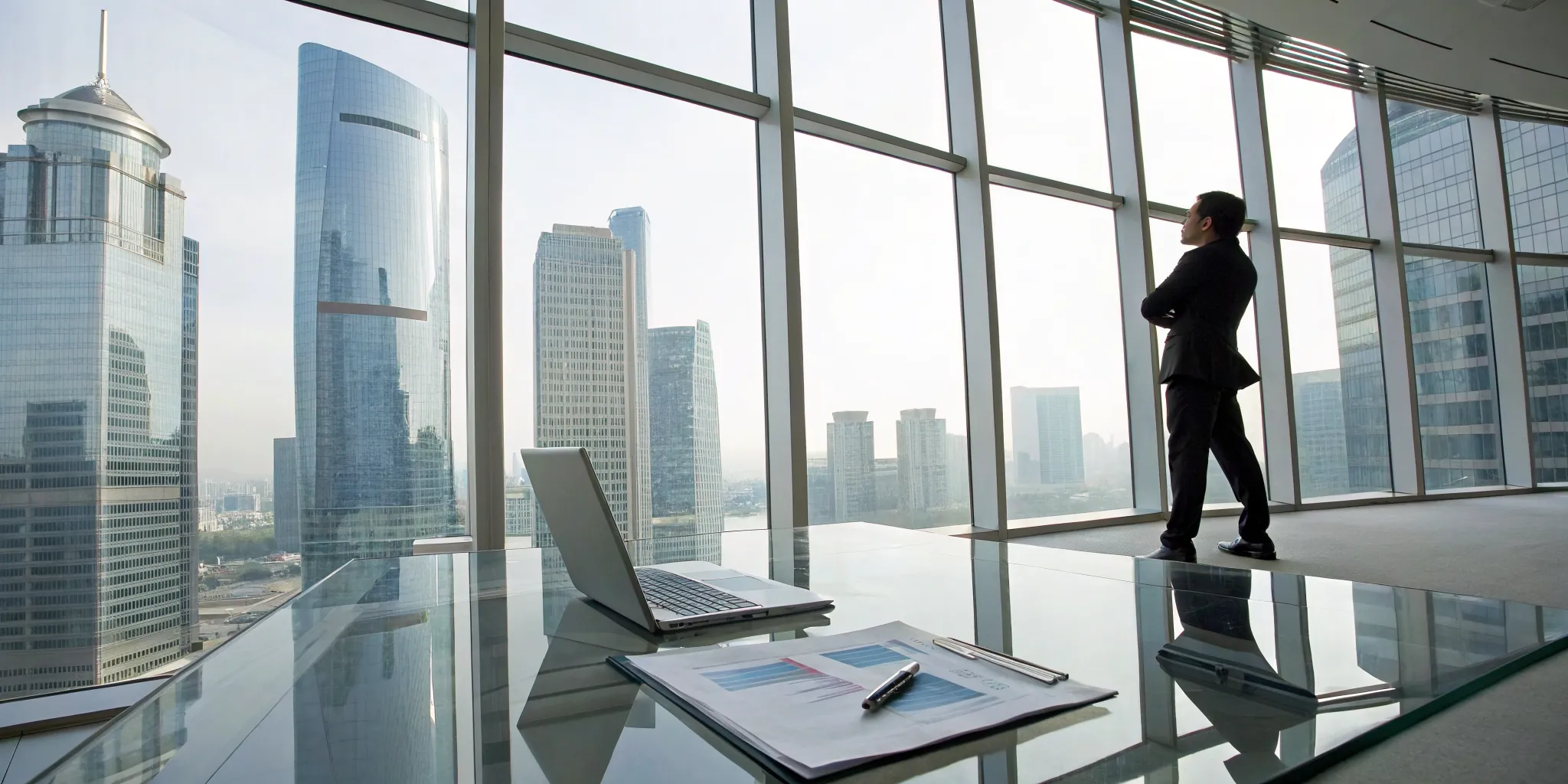 Real estate CFO consultant planning a tax strategy with financial documents for portfolio growth.